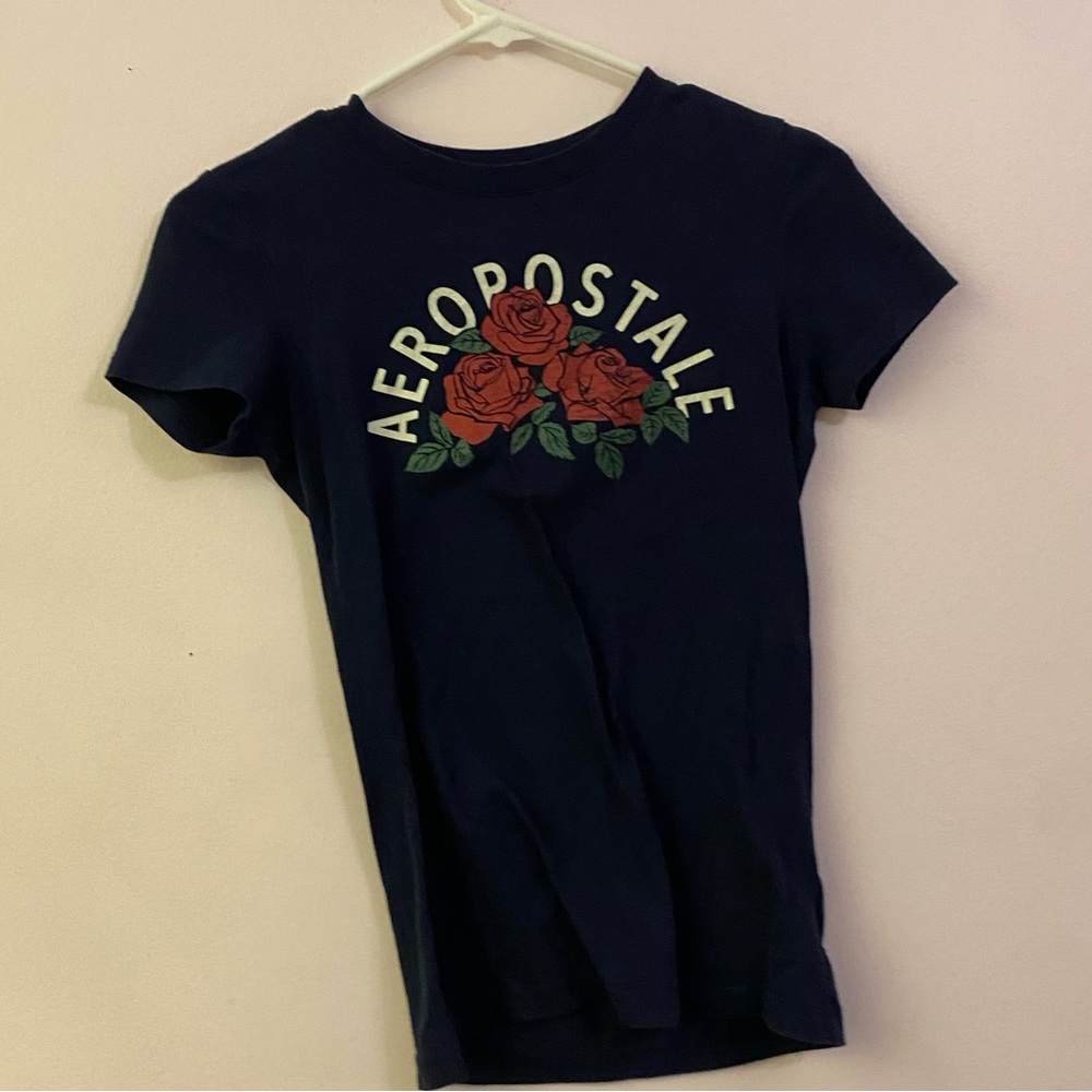 blue tee with roses design